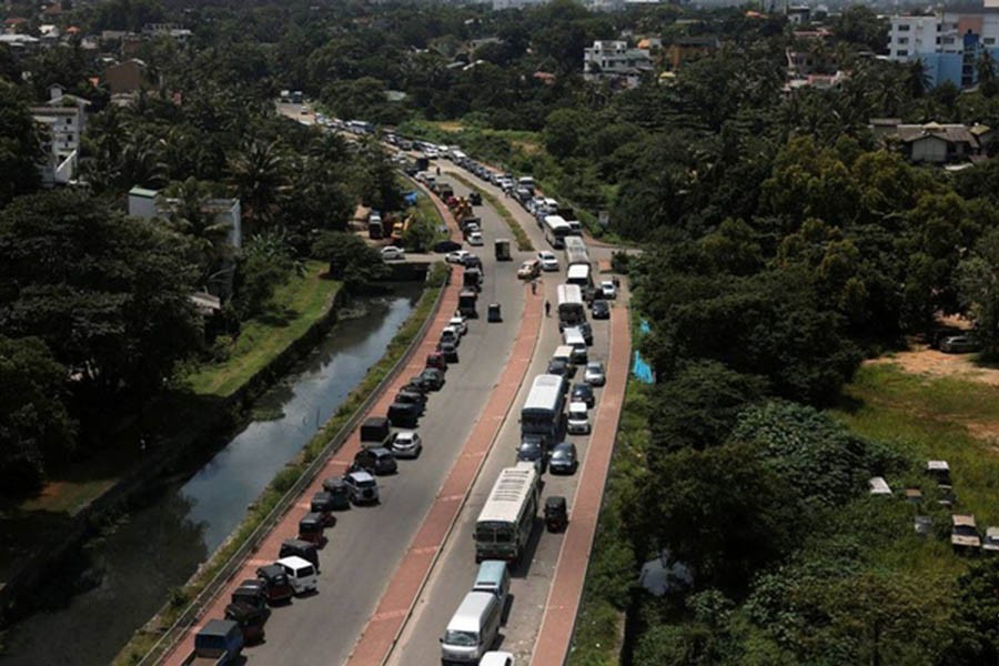 Diesel vehicles queue up in a long line to buy diesel due to a fuel shortage countrywide, amid the country's economic crisis, in Colombo, Sri Lanka, Jun 8, 2022. Reuters. Dinuka Liyanawatte