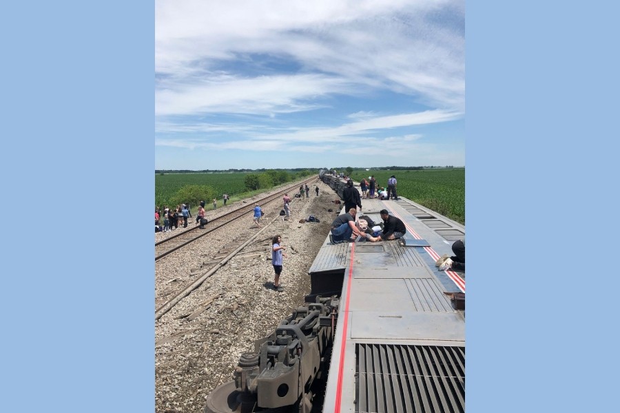 People exit from an Amtrak train that derailed after hitting a dump truck at an uncontrolled crossing, near Mendon, Missouri, US, June 27, 2022 in this picture obtained from social media. Dax McDonald/via REUTERS