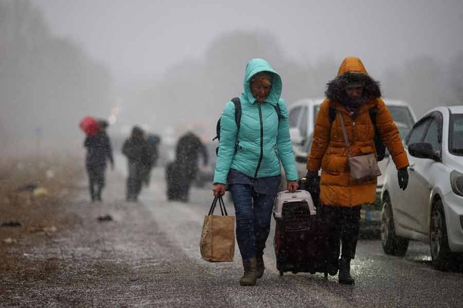 People fleeing Russia's military operation against Ukraine walking toward the Shehyni border, outside Mostyska,  in February this year –Reuters file photo
