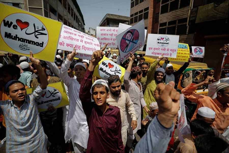 Muslims chanting slogans as they hold placards during a protest in Ahmedabad on June 10 this year demanding the arrest of Bharatiya Janata Party (BJP) member Nupur Sharma for her comments against Prophet Mohammed (PBUH) –Reuters file photo