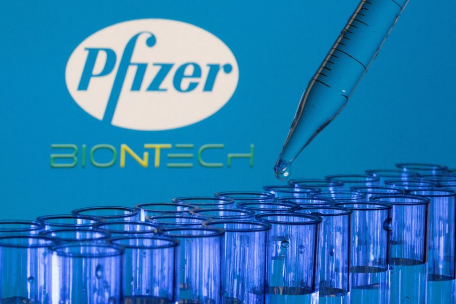Test tubes are seen in front of displayed Pfizer and Biontech logos in this illustration taken on May 21, 2021 — Reuters/Files