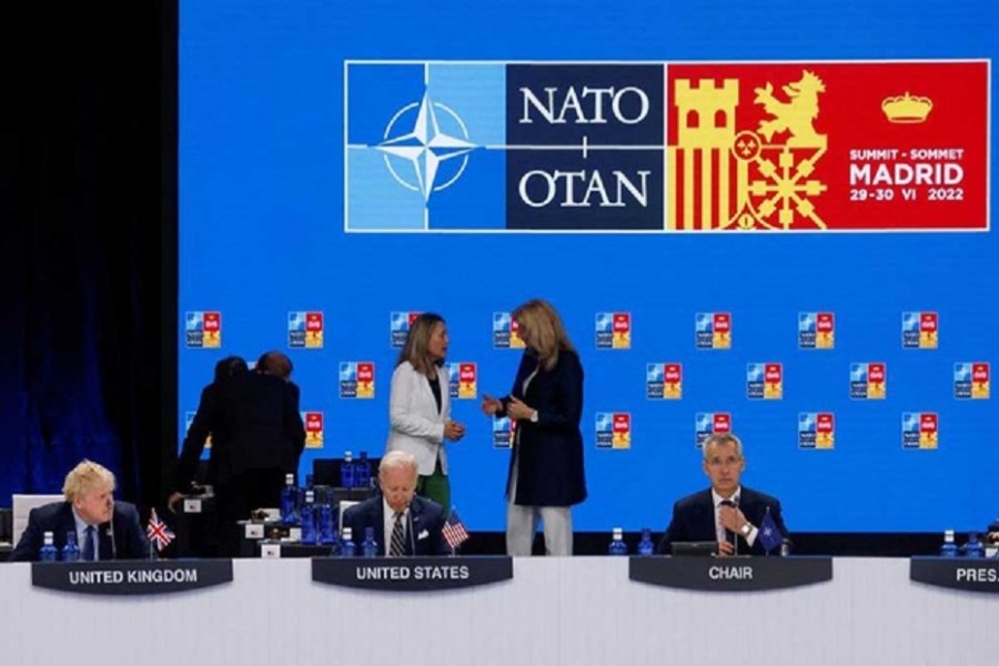 British Prime Minister Boris Johnson, US President Joe Biden and NATO Secretary General Jens Stoltenberg attend the round table of a NATO summit in Madrid, Spain June 30, 2022. REUTERS/Yves Herman