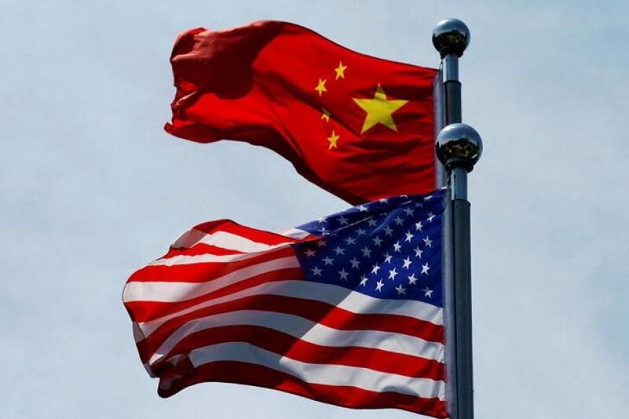 Chinese and US flags flutter near The Bund, before U.S. trade delegation meet their Chinese counterparts for talks in Shanghai, China July 30, 2019. REUTERS/Aly Song