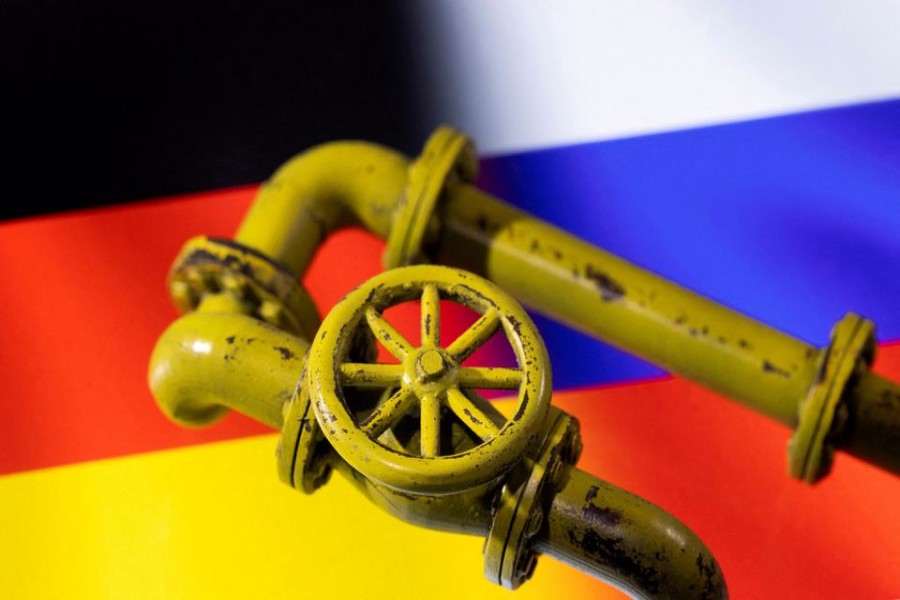 3D printed Natural Gas Pipes are placed on displayed German and Russian flags in this illustration taken, January 31, 2022. REUTERS/Dado Ruvic/File Photo