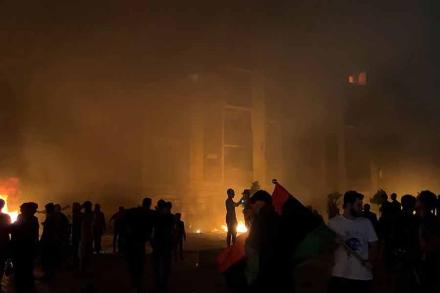 Protesters setting fire to the Libyan parliament building in Tobruk after protests against the failure of the government on Friday –Reuters photo