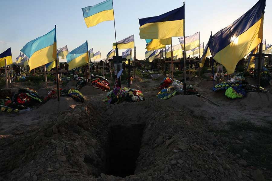A fresh hole is seen ahead of a funeral, among dozens of recent graves of people who have died since the beginning of Russia's invasion, in the Walk of Heroes section of the cemetery, where people who served as military members, fire fighters and police officers are buried, as Russia's attack continues, in Kharkiv of Ukraine, on Saturday –Reuters photo