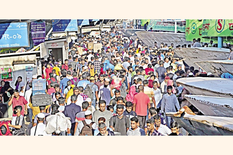 People in droves gather at Sadarghat launch terminal in Dhaka on Thursday as they are in a rush to go home for observing Eid-ul-Azha with their near and dear ones — FE photo by Shafiqul Alam