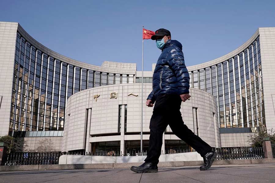 A man walking past the headquarters of the People's Bank of China in Beijing of China –Reuters file photo