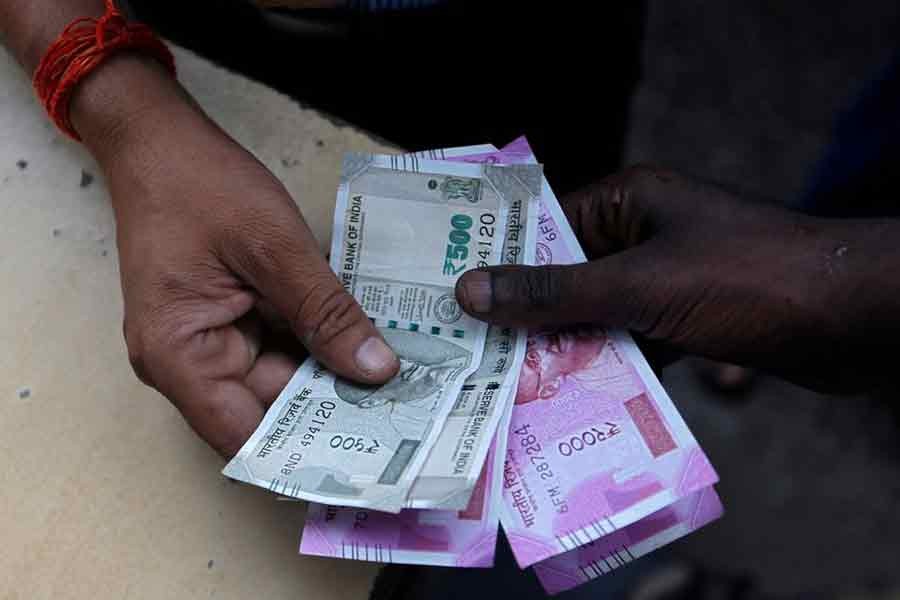 Indian rupee falls past 80 against dollar to hit record low
