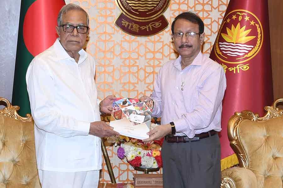 Convener of the National Implementation Committee of Father of the Nation Bangabandhu Sheikh Mujibur Rahman Birth Centenary Celebration Kamal Abdul Naser Chowdhury handing over a report on the celebration to President Abdul Hamid at Bangabhaban on Wednesday evening –PID photo