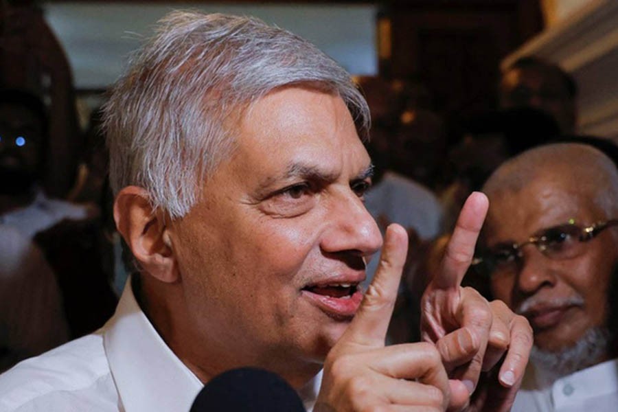 Ranil Wickremesinghe who has been elected as the Eighth Executive President under the Constitution speaks to media as he leaves a Buddhist temple, amid the country's economic crisis, in Colombo, Sri Lanka July 20, 2022. REUTERS/ Dinuka Liyanawatte