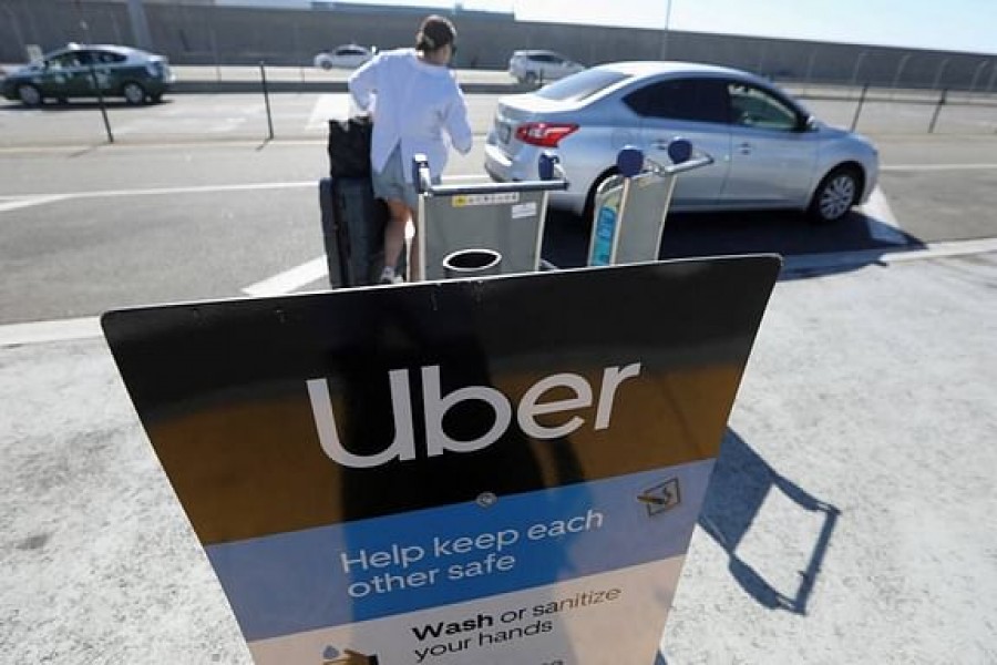 Uber signage is posted at Los Angeles International Airport (LAX) in Los Angeles, Jul 10, 2022. Reuters