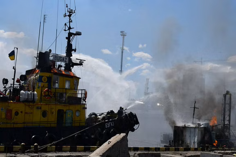 Firefighters work at a site of a Russian missile strike in a sea port of Odesa, as Russia's attack on Ukraine continues, Ukraine July 23, 2022. Press service of the Joint Forces of the South Defence via REUTERS