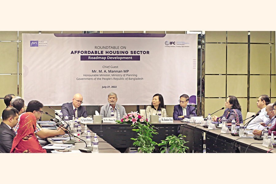 Planning Minister MA Mannan speaks as the chief guest at a roundtable on 'Affordable Housing Sector: Roadmap Development' arranged by International Finance Corporation (IFC) in collaboration with Policy Research Institute of Bangladesh (PRI) at a hotel in the capital on Wednesday — FE photo