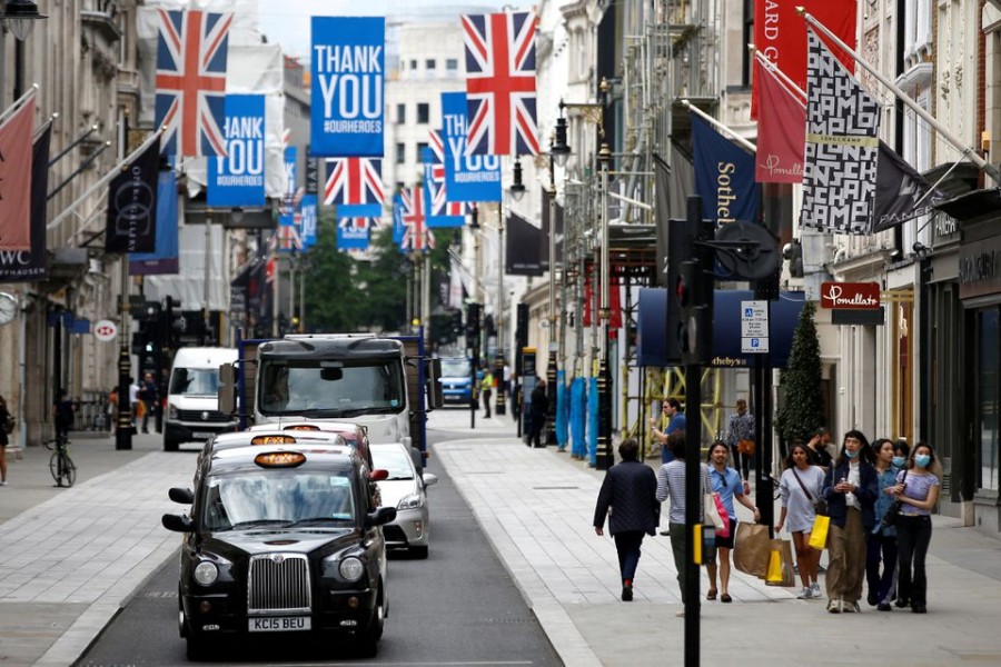 People walk along New Bond Street in London, Britain, June 15, 2020. REUTERS/Henry Nicholls/File Photo