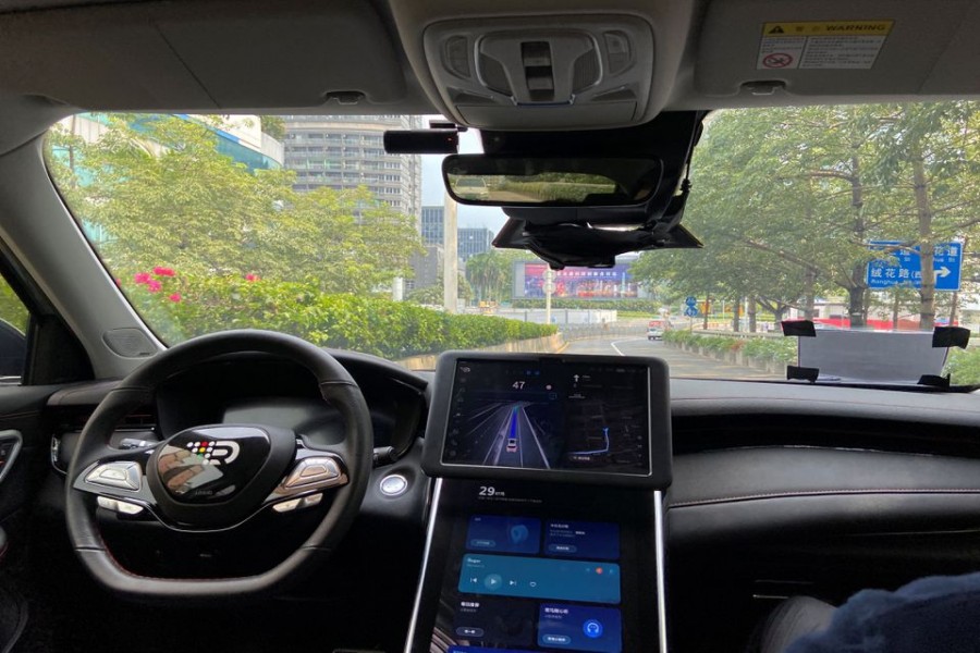 A safety driver sits on the passenger seat as the car with autonomous driving system by DeepRoute.ai, drives itself on a street in Shenzhen, Guangdong province, China July 29, 2022. REUTERS/David Kirton