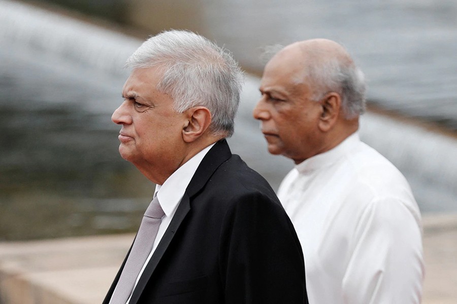 Sri Lanka's President Ranil Wickremesinghe and Prime Minister Dinesh Gunawardena look on after attending the inauguration of a new session of parliament and the first policy statement by Wickremesinghe, amid the country's economic crisis, in Colombo, Sri Lanka on August 3, 2022 — Reuters/Files