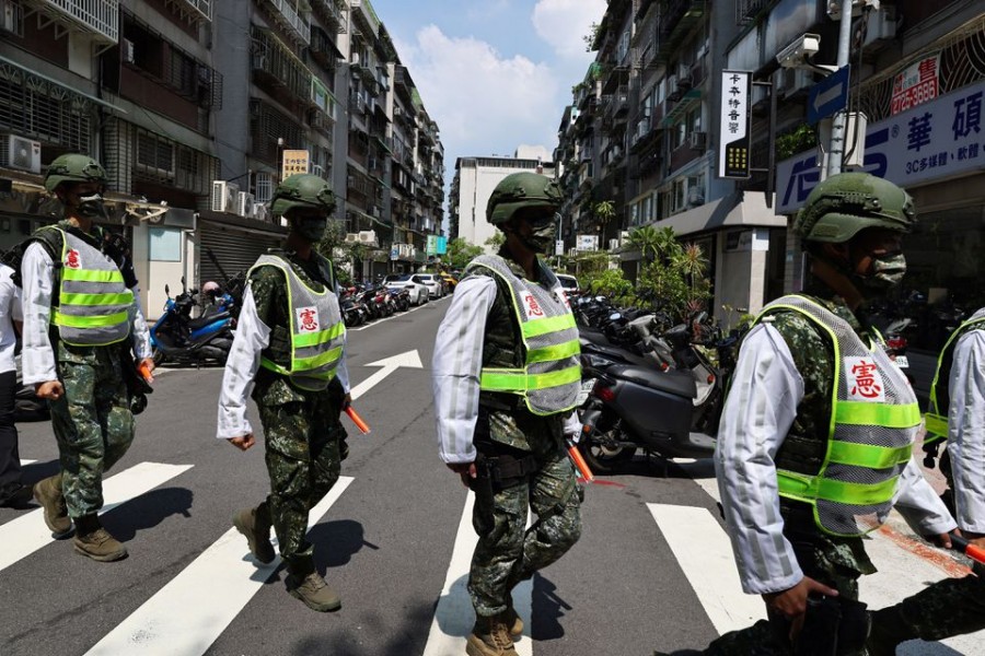 Military police officers get into position for a drill on how to guide citizens to safety in the event of an attack, in Taipei, Taiwan on July 22, 2022. — Reuters/Files