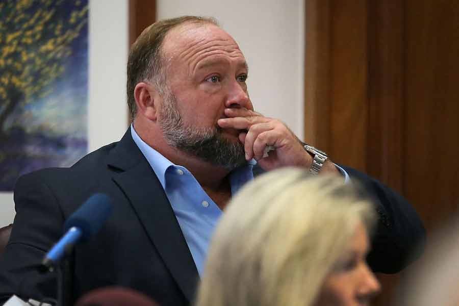 Alex Jones attempting to answer questions about his text messages asked by Mark Bankston, lawyer for Neil Heslin and Scarlett Lewis, during trial at the Travis County Courthouse , Austin, Texas, US, recently –Reuters file photo