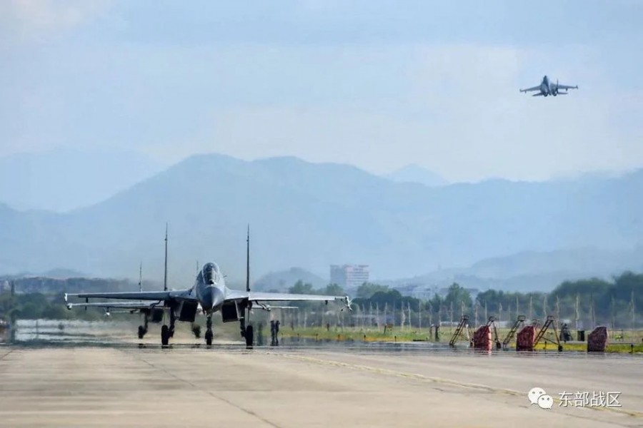 An Air Force aircraft under the Eastern Theatre Command of China's People's Liberation Army (PLA) takes off for military exercises in the waters around Taiwan, from an undisclosed location in this August 4, 2022 handout released on August 5, 2022. Eastern Theatre Command/Handout via REUTERS