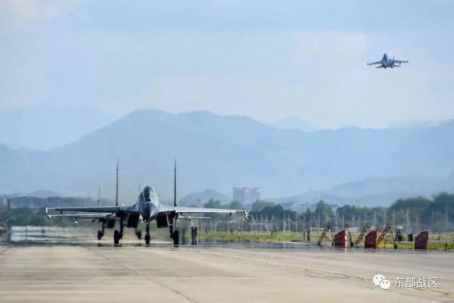 An Air Force aircraft under the Eastern Theatre Command of China's People's Liberation Army (PLA) takes off for military exercises in the waters around Taiwan, from an undisclosed location in this Aug 4, 2022 handout released on Aug 5, 2022. Eastern Theatre Command/Handout via REUTERS