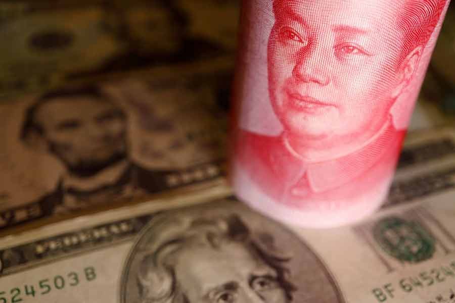 US Dollar and Chinese Yuan banknotes are seen in this illustration picture taken on June 14 this year –Reuters file photo
