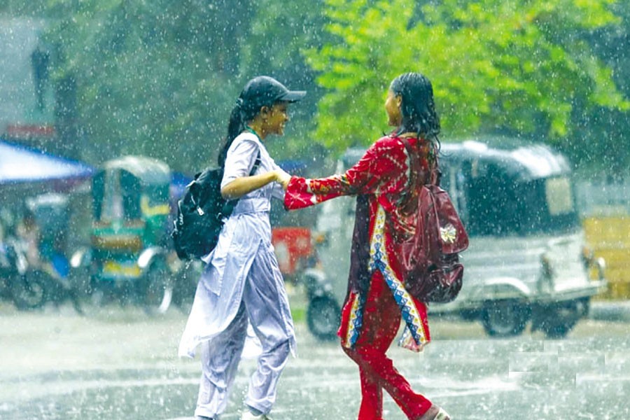 Students enjoy the rain in Dhaka. 	—bdnews24.com Photo