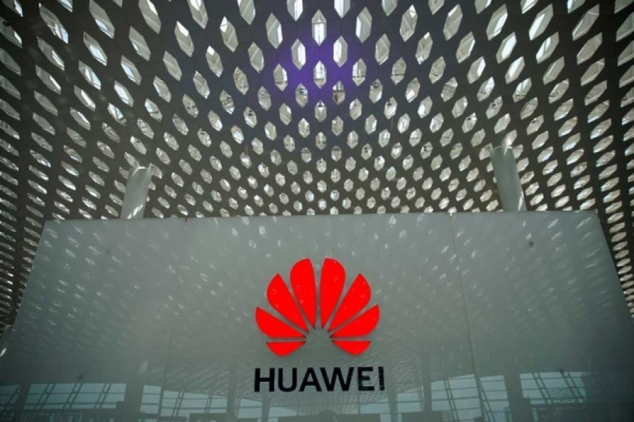 China's Huawei says first-half profit drops 52pc as demand weakens