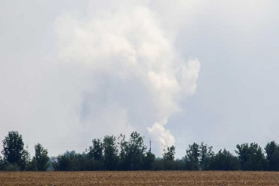 A view shows smoke rising above the area following an alleged explosion in the village of Mayskoye in the Dzhankoi district, Crimea, August 16, 2022. REUTERS/Stringer