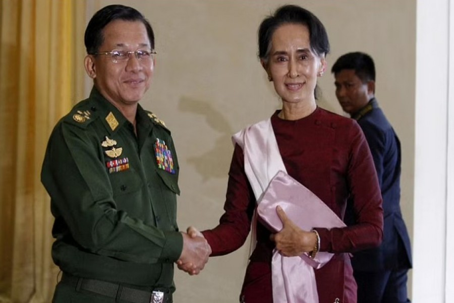 Senior General Min Aung Hlaing, Myanmar's commander-in-chief, shakes hands with National League for Democracy (NLD) party leader Aung San Suu Kyi before their meeting in Hlaing's office at Naypyitaw Dec 2, 2015. REUTERS/Soe Zeya Tun