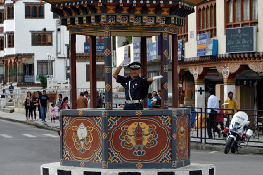 A Bhutanese traffic policeman directs the traffic at a road in Thimphu on May 21, 2012 — Reuters/Files