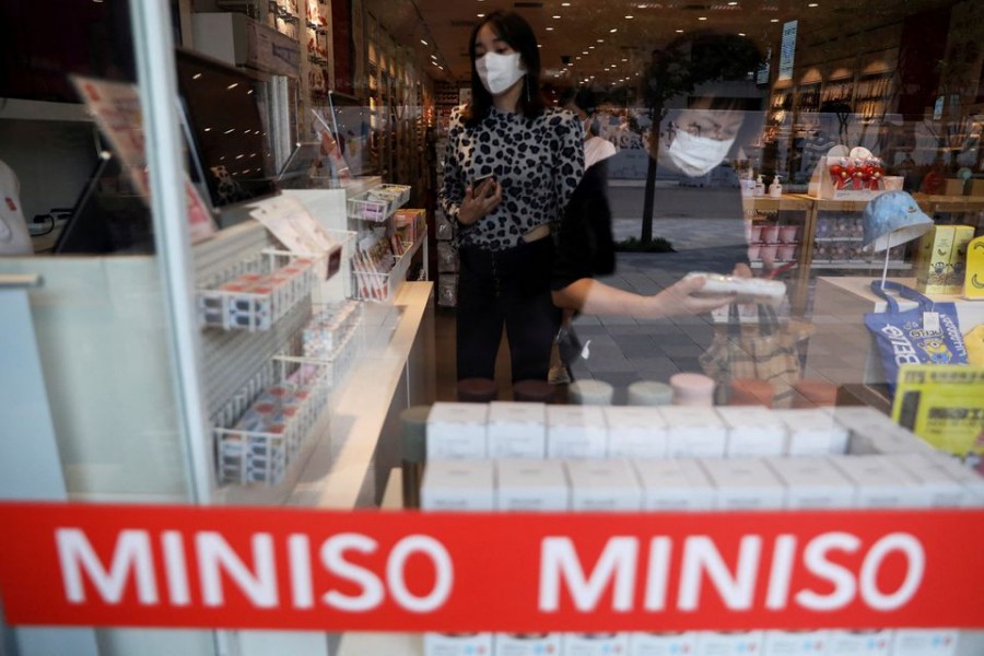 Customers shop at a store of Chinese retailer MINISO Group in Beijing, China September 13, 2021. Picture taken September 13, 2021. REUTERS/Tingshu Wang