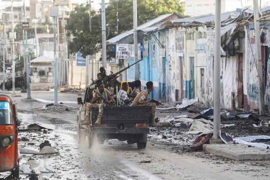 Somali security officers driving past a section of Hotel Hayat, the scene of an al Qaeda-linked al Shabaab group militant attack in Mogadishu, in Somalia on Saturday –Reuters photo