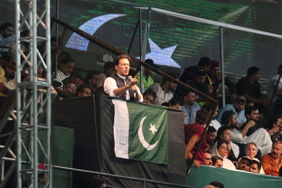 Former Prime Minister Imran Khan addresses his party supporters during a rally in Lahore, Pakistan [File: KM Chaudary/AP Photo]