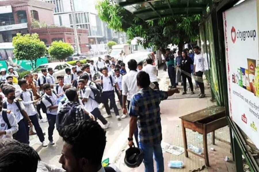 Students block road demanding half bus fare in Dhaka 