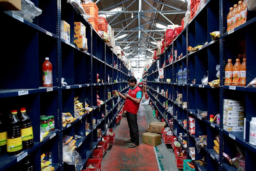 An employee scans a package for an order at a BigBasket warehouse on the outskirts of Mumbai on November 4, 2014 — Reuters/Files