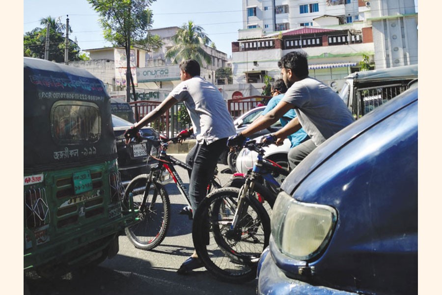 Roads in Dhaka are not friendly for cycling 	—www.urbancyclinginstitute.com Photo