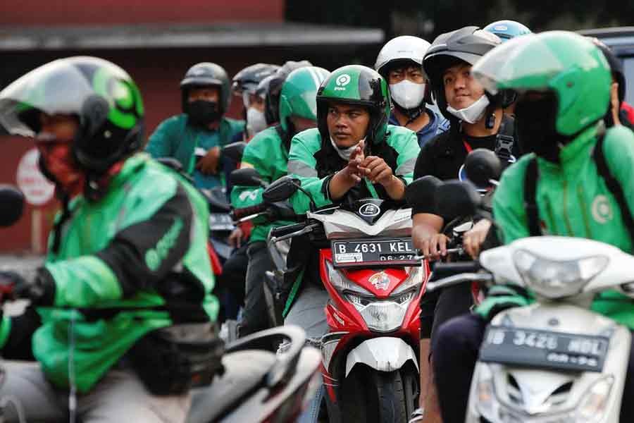 Motorcycle drivers waiting in line to buy subsidised fuel at a petrol station in Jakarta of Indonesia recently –Reuters file photo