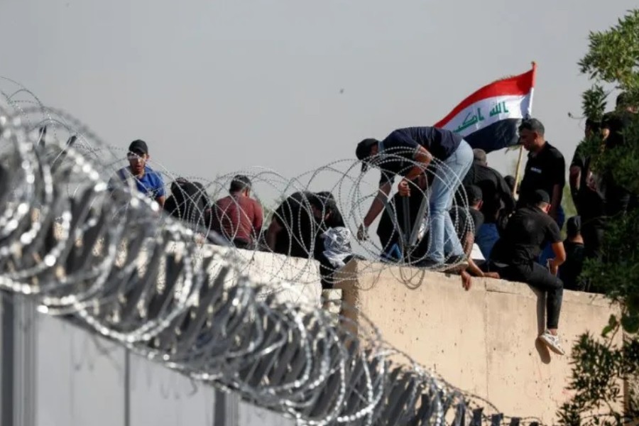 Supporters of Iraqi populist leader Moqtada al-Sadr protest at the Green Zone, in Baghdad