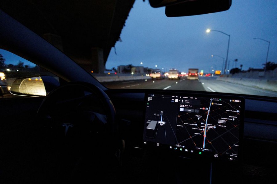 A Tesla Model 3 vehicle drives on autopilot along the 405 highway in Westminster, California, US on March 16, 2022 — Reuters/Files