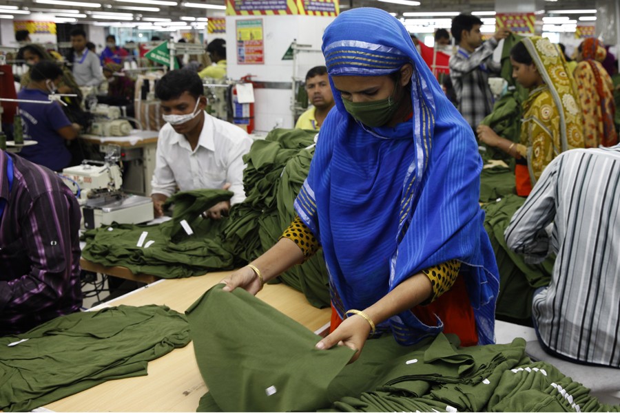 A garment worker at a factory in Dhaka. 	—FE Photo
