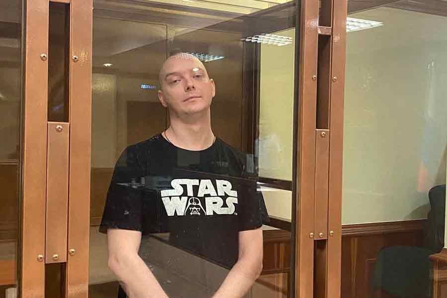 Ivan Safronov, a former journalist and an aide to the head of Russia's space agency Roscosmos who remains in custody on state treason charges, standing inside a defendants' cage as he attends a court hearing in Moscow on August 30 this year –Reuters file photo