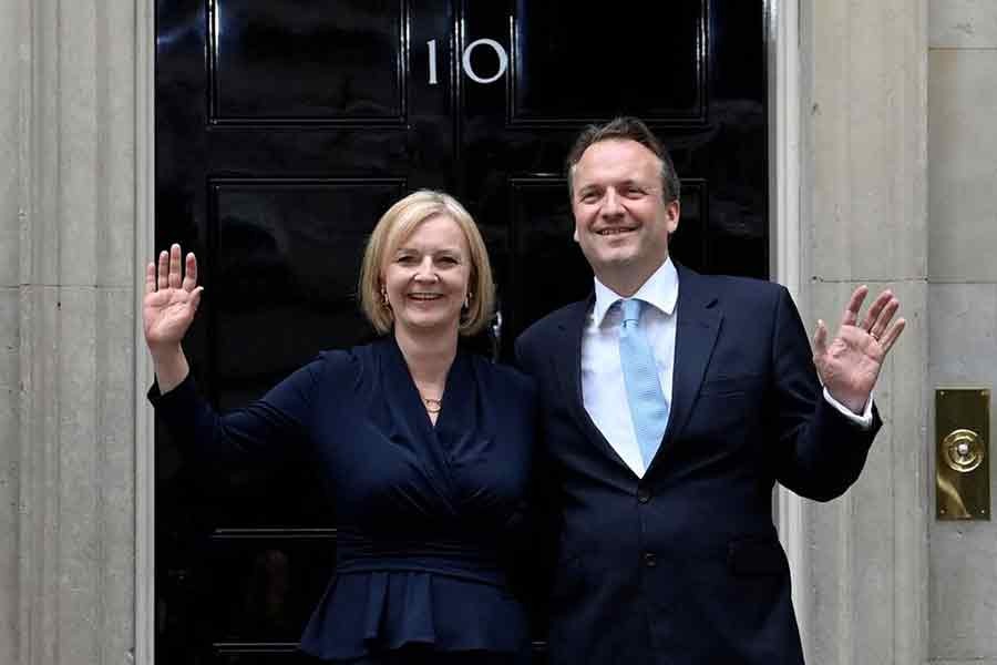 New British Prime Minister Liz Truss and her husband Hugh O'Leary waving outside Downing Street in Britain on Tuesday –Reuters photo
