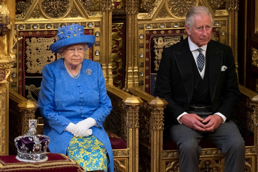 Britain's Queen Elizabeth sits next to Prince Charles during the State Opening of Parliament in central London, Britain June 21, 2017. Stefan Rousseau/Pool via REUTERS/File Photo