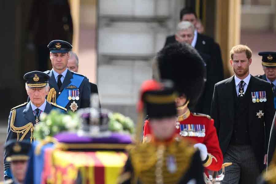Britain's King Charles III, Prince of Wales Prince William and Duke of Sussex Prince Harry walking behind the coffin of Queen Elizabeth II during a procession from Buckingham Palace to the Palace of Westminster in London on  Wednesday –Reuters photo