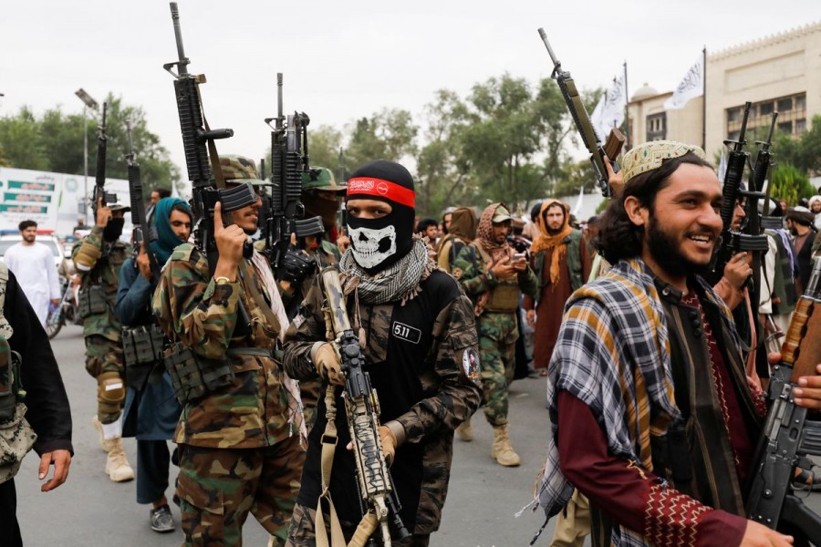 Taliban fighters celebrate the first anniversary of the fall of Kabul on a street in Kabul, Afghanistan, August 15, 2022. REUTERS/Ali Khara