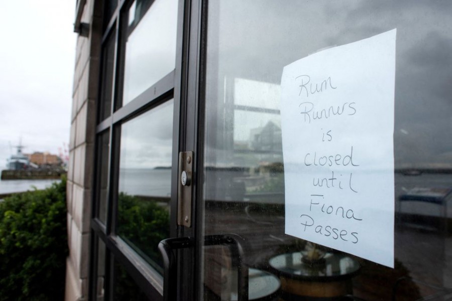 A sign outside Rum Runners sweets shop shows its closure before the arrival of Hurricane Fiona in Halifax, Nova Scotia, Canada September 23, 2022. REUTERS/Ingrid Bulmer