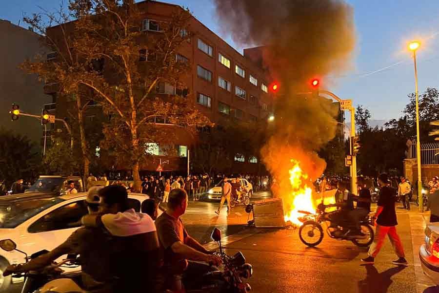 A police motorcycle burning during a protest over the death of Mahsa Amini, a woman who died after being arrested by the Islamic republic's ‘morality police, in Tehran on September 19 this year –Reuters file photo