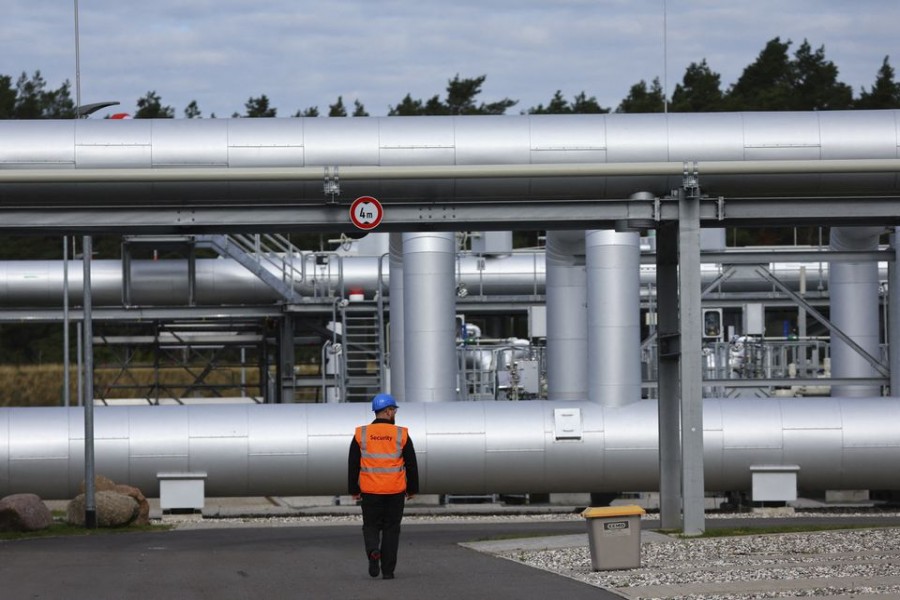 Security walks in front of the landfall facility of the Baltic Sea gas pipeline Nord Stream 2 in Lubmin, Germany, September 19, 2022. REUTERS/Fabrizio Bensch/File Photo