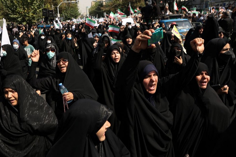 Pro-government peoples rally against the recent protest gatherings in Iran, after the Friday prayer ceremony in Tehran, Iran September 23, 2022. Iranians have staged mass protests over the case of Mahsa Amini, 22, who died last week after being arrested by the morality police for wearing "unsuitable attire".WANA (West Asia News Agency) via REUTERS